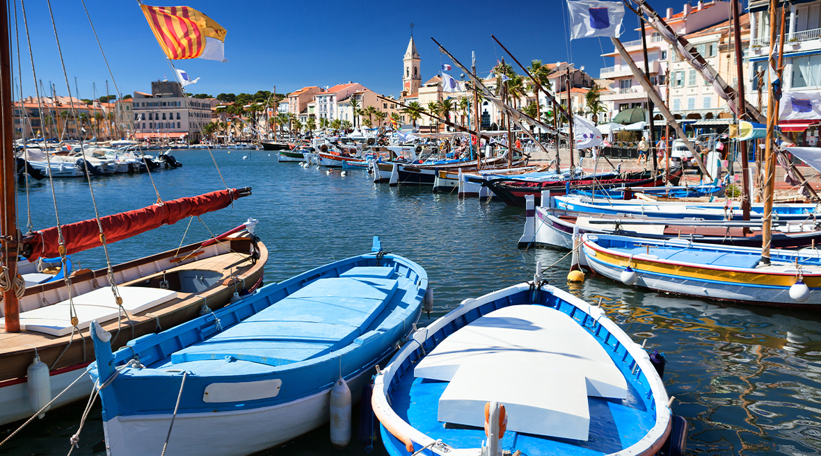 boats in the harbour on sunny blue waters